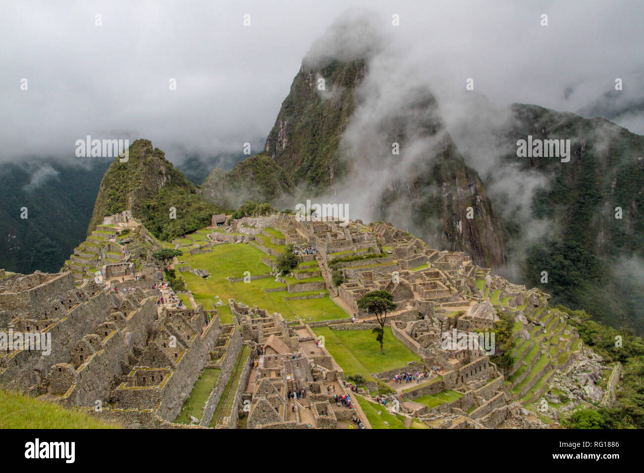Panoramic view of Machu Picchu, the world famous ancient inca city, hidden in the cloud forest mountains of Peru in South america Stock Photo
