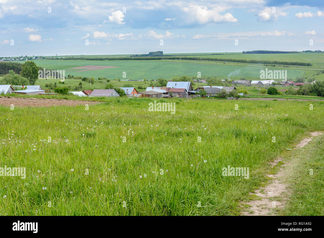The village is surrounded by forests and meadows in the summer Stock Photo