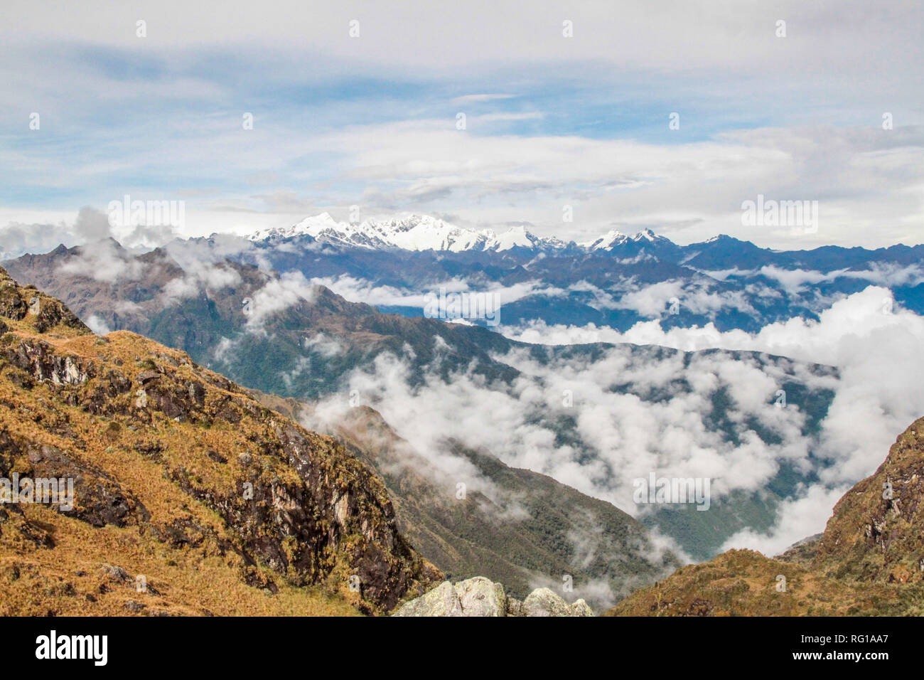Breathtaking view of the andean landscape following the world famous hiking trail Inca Trail in Peru, through a mysterious landscape of cloud forest Stock Photo
