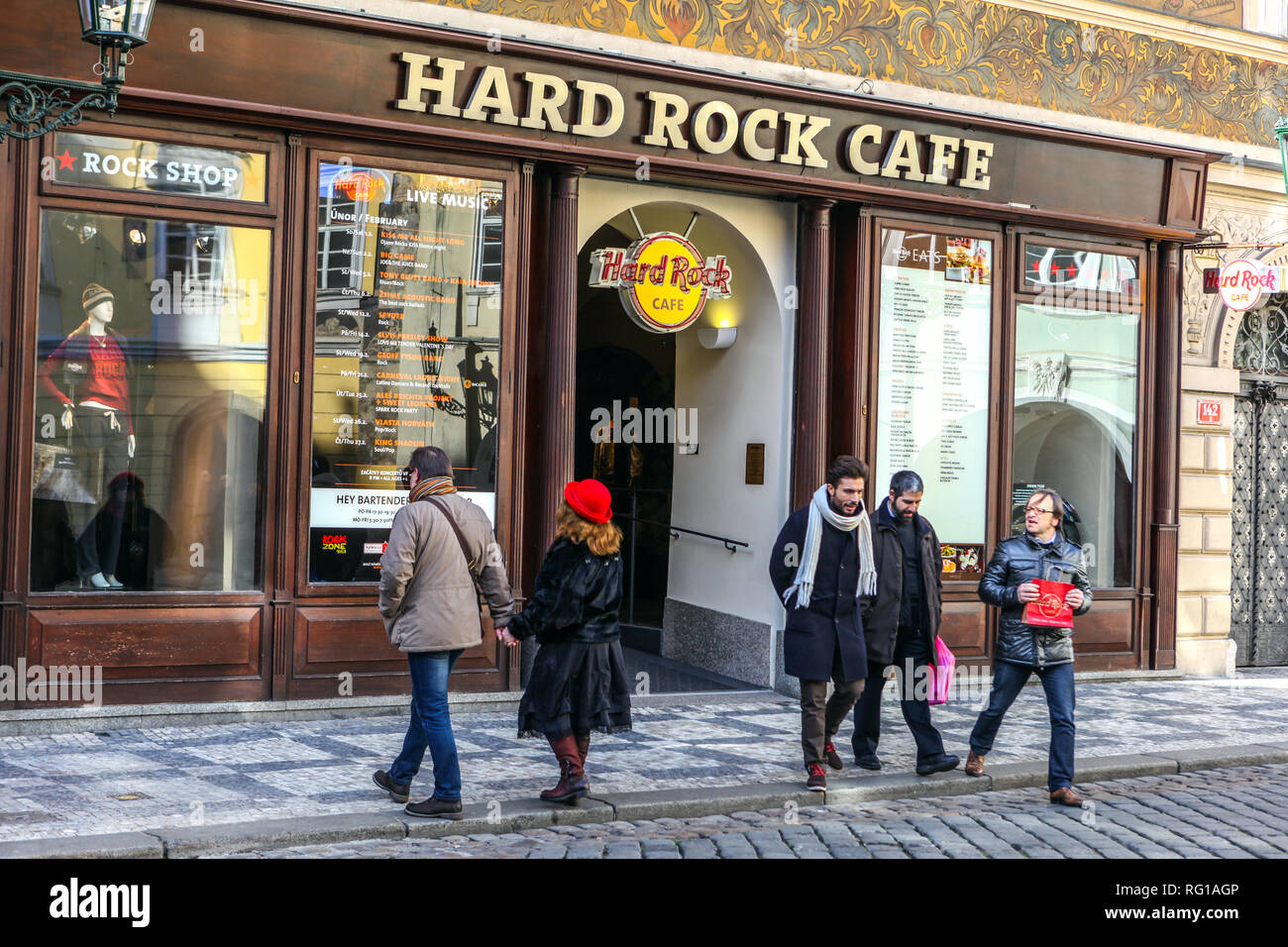 Tourists in front of famous bar Hard Rock Cafe on Male Namesti Square, Prague Old Town Little Square Czech Republic Stock Photo