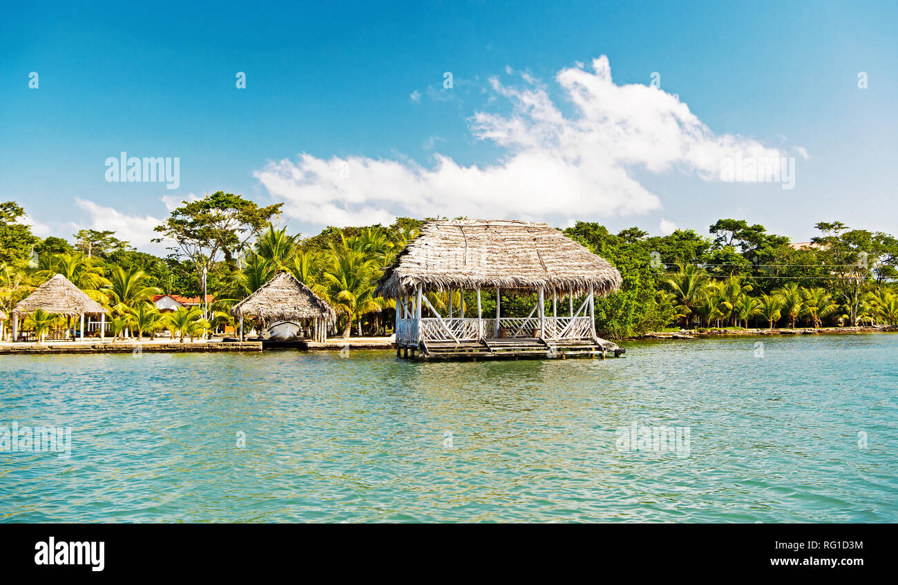 Huts on sea shore in guatemala, santo tomas. Houses of wood and grass