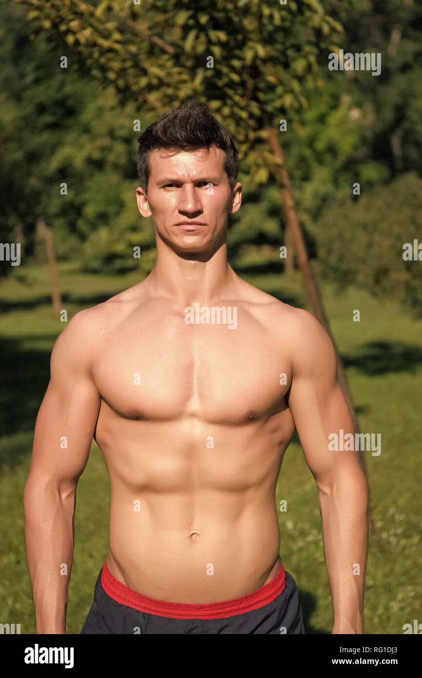 Man with athletic torso on natural landscape, bodybuilding. Sportsman with  six pack, ab, chest, biceps, triceps, bodycare. Power, strength, fitness  Sport bodycare energy health activity wellness Stock Photo - Alamy