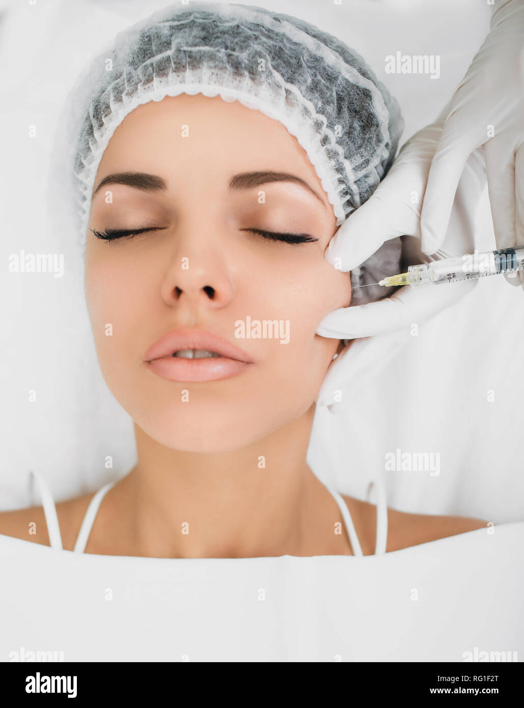botulinum toxin injection into face, for lifting skin . Face injection top view Stock Photo