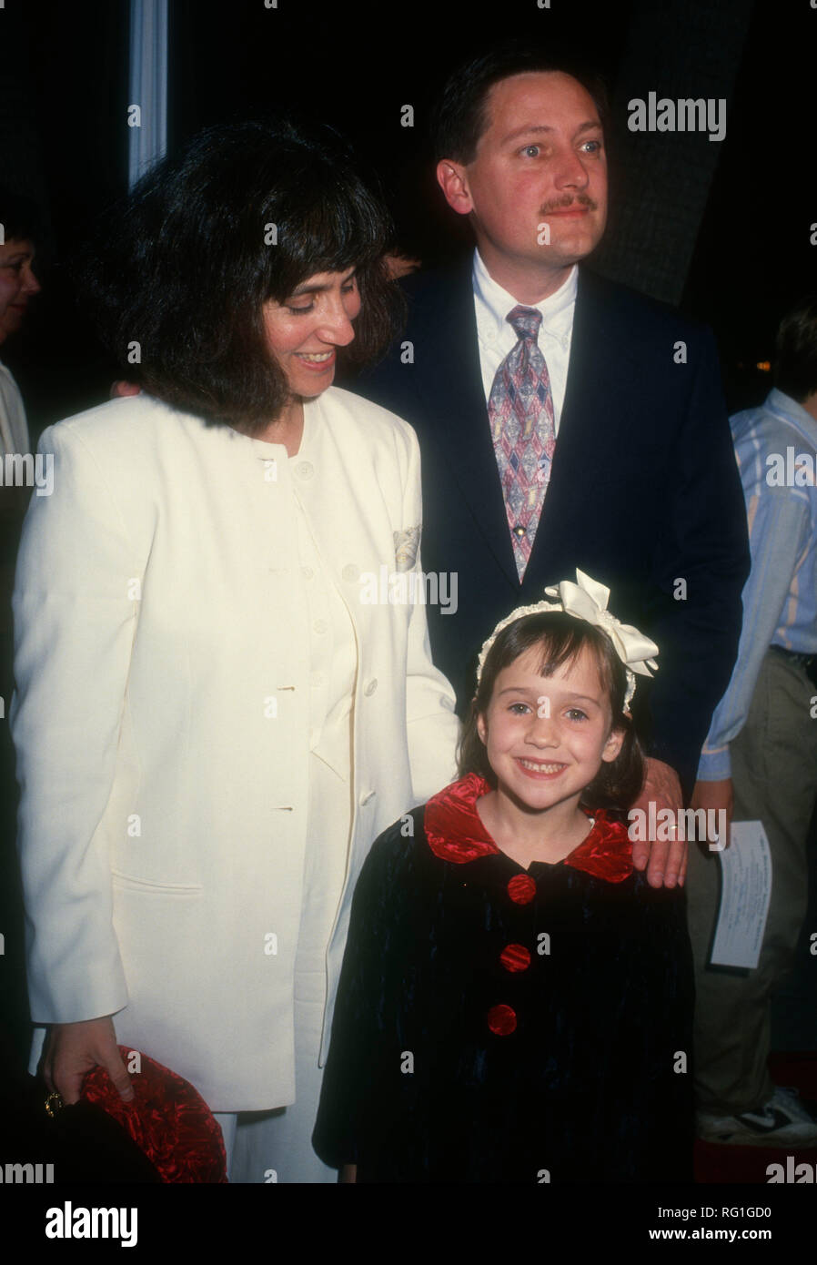 BEVERLY HILLS, CA - NOVEMBER 22: Actress Mara Wilson, mother Suzie Shapiro and father Michael Wilson attend 20th Century Fox's' 'Mrs. Doubtfire' Premiere on November 22, 1993 at The Academy of Motion Picture Arts & Sciences in Beverly Hills, California. Photo by Barry King/Alamy Stock Photo Stock Photo