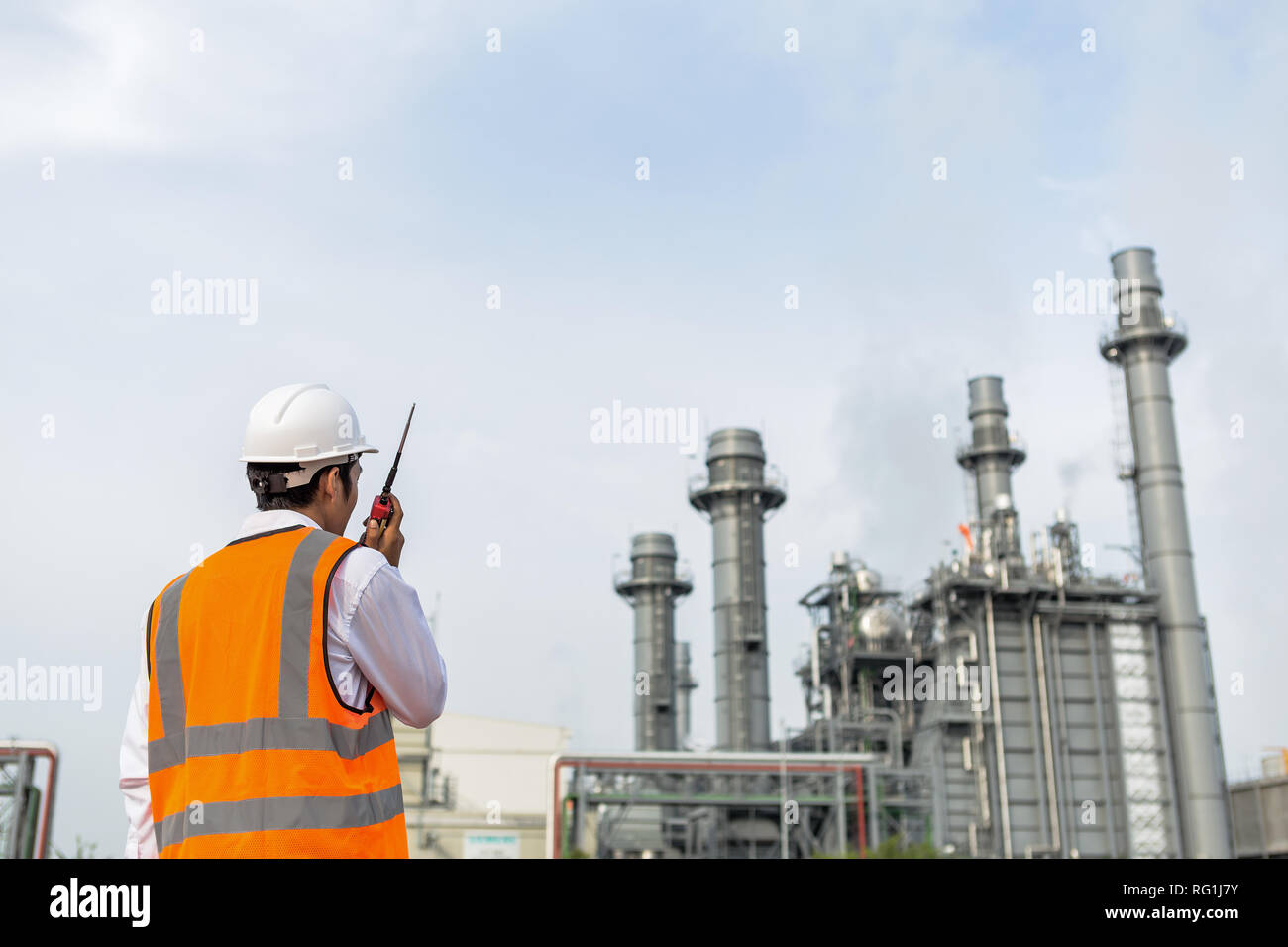 Engineer is checking around gas turbine electric power plant Stock