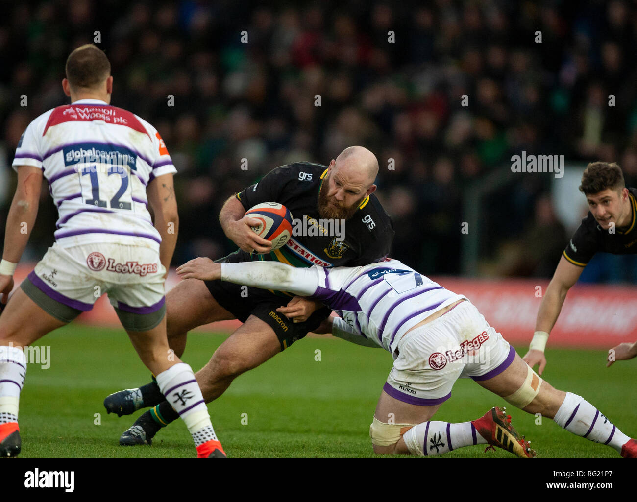 Northampton, UK. 26th January 2019. Ben Franks of Northampton Saints is tackled by Will Evans during the Premiership Rugby Cup match between Northampton Saints and Leicester Tigers. Andrew Taylor/Alamy Live News Stock Photo