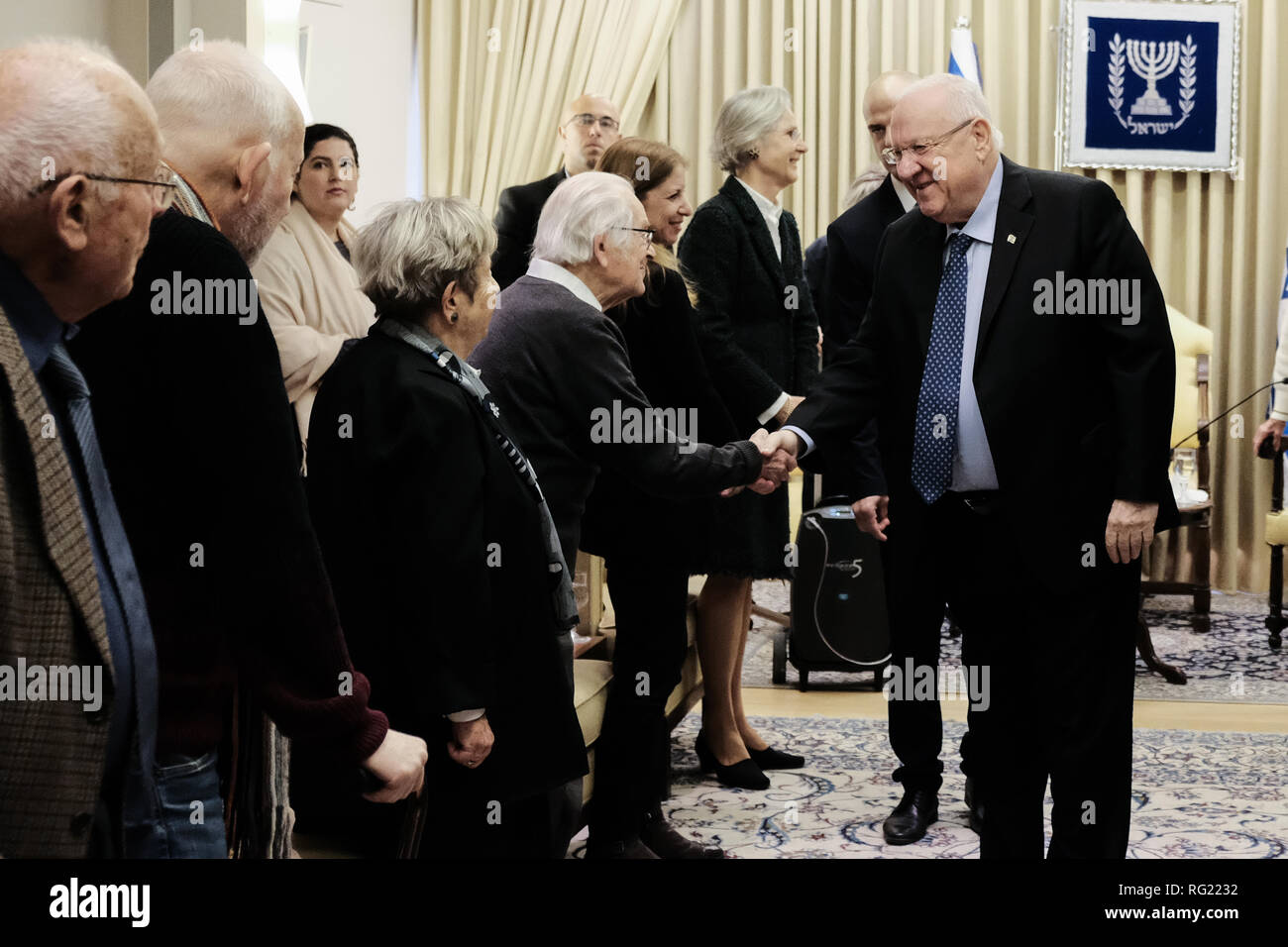 Jerusalem, Israel. 27th January, 2019. Israeli President REUVEN RIVLIN greets guests as he hosts Aktion Sühnezeichen Friedensdienste (Action Reconciliation Service for Peace) at the President's Residence, bringing together Holocaust survivors and ASF volunteers as well as German Ambassador to Israel Dr. Susanne Wasum Rainer on International Holocaust Remembrance Day. nd with Holocaust survivors in Israel. Credit: Nir Alon/Alamy Live News Stock Photo