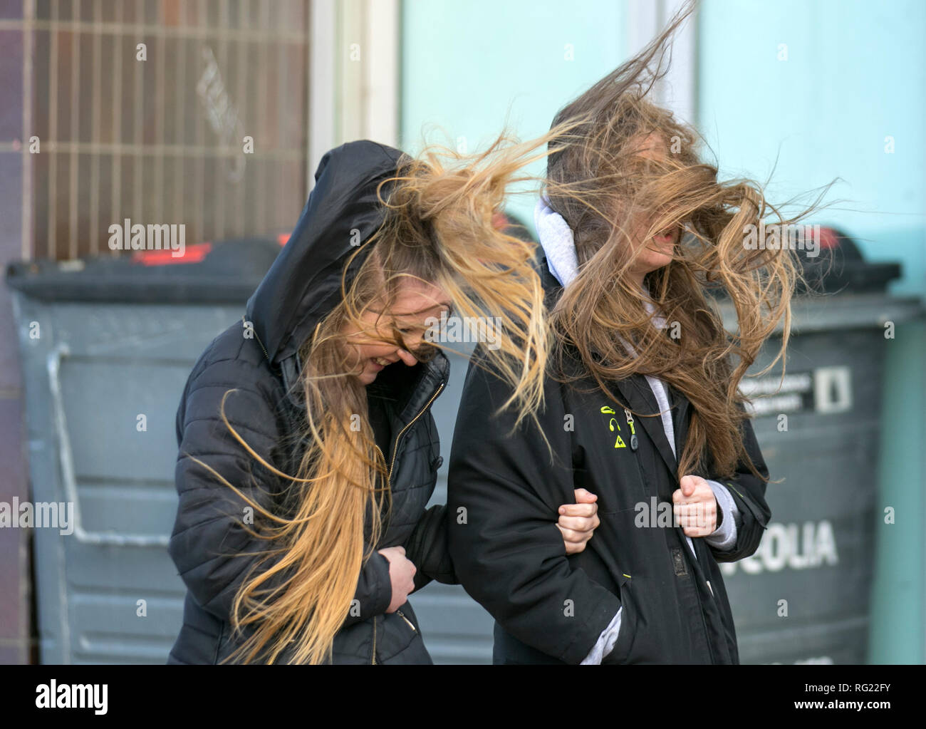 Blackpool, Lancashire. 27th Jan, 2019. UK Weather. Gale force winds at the coast. Visitors to the seaside town have to endure severe winds with pedestrians being blown over on the seafront promenade. Storm , blow, tempest, flyaway hair, tangled tresses, bad hair day on the seafront promenade.Credit:MediaWorldImages/AlamyLiveNews Stock Photo
