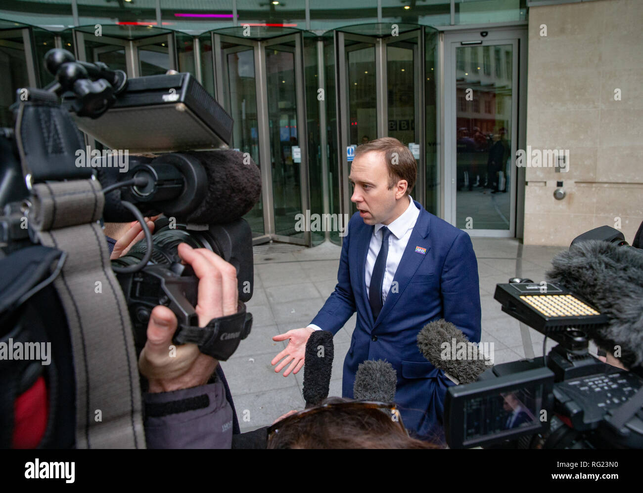 London, UK. 27th January, 2019. Matthew Hancock, Secretary of State for Health and Social care, speaks to the waiting media after appearing on the Andrew Marr Television Show at the BBC Studios. He said that the Government have not ruled out banning social media fims if they fail to remove content that promotes self-harm and suicide. Credit: Tommy London/Alamy Live News Stock Photo