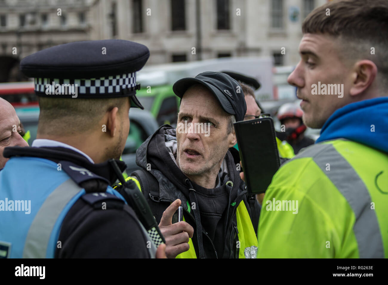 London,UK. 26 January, 2019. Right-wing yellow vest protesters try to block traffic at Trafalgar Square. David Rowe/Alamy Live News. Stock Photo