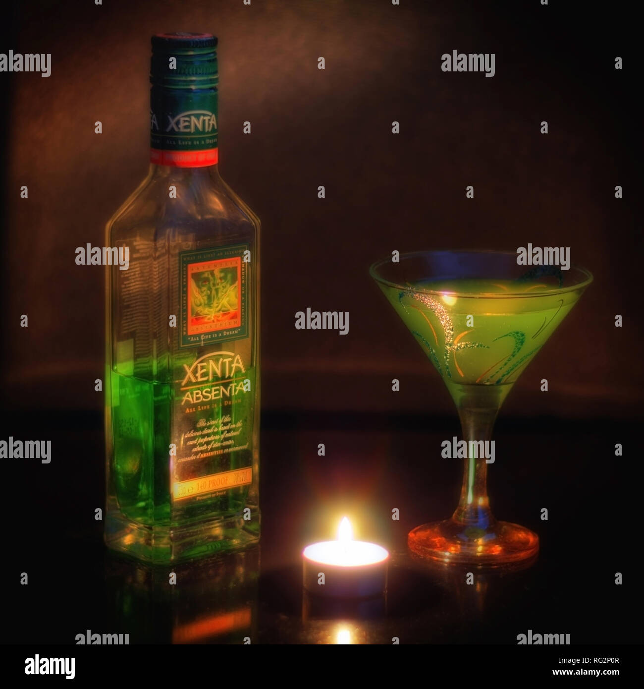 Still Life With A Bottle Of Absinthe A Glass And A Candle On The Table Stock Photo Alamy