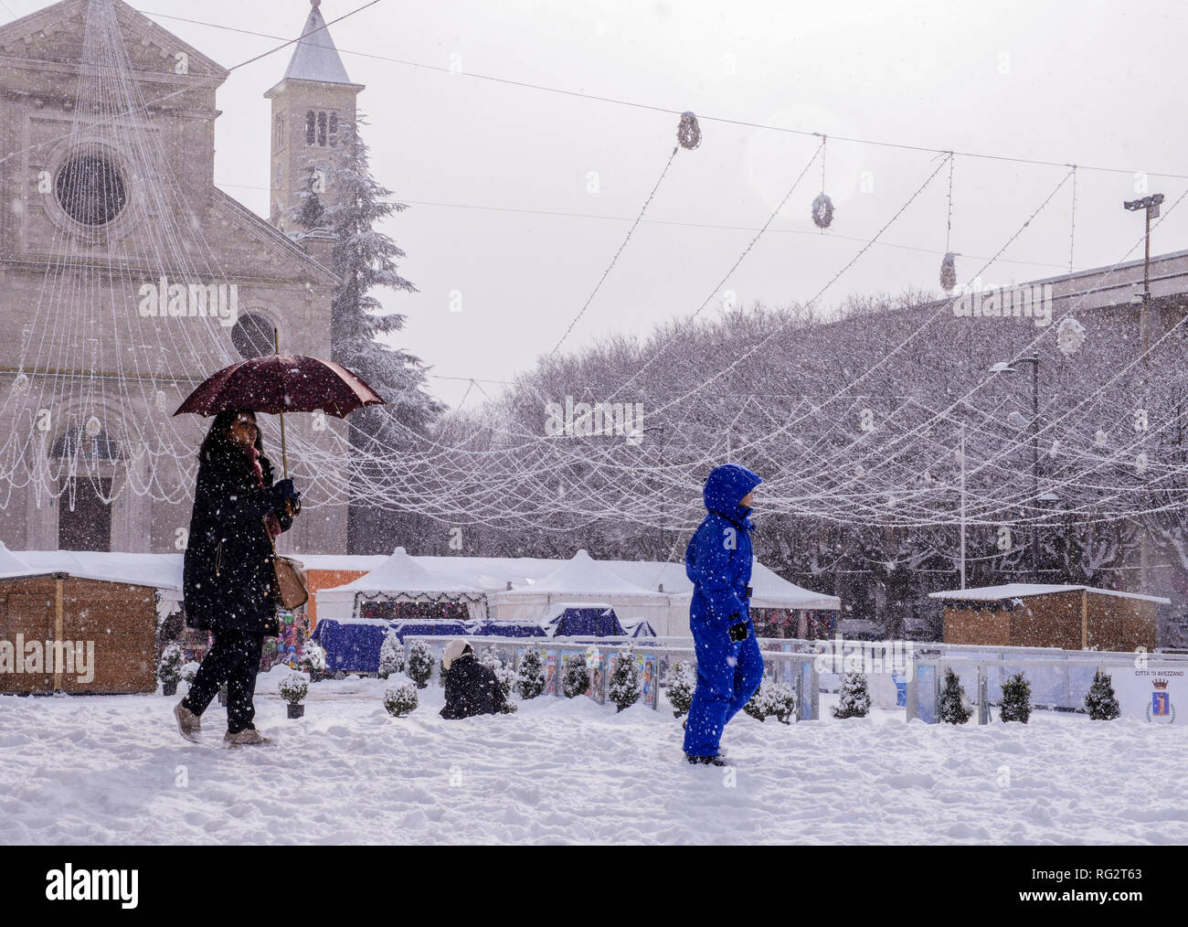 Woman and child, walking in snow during snowstorm, Avezzano, Abruzzo region, Italy, Europe Stock Photo