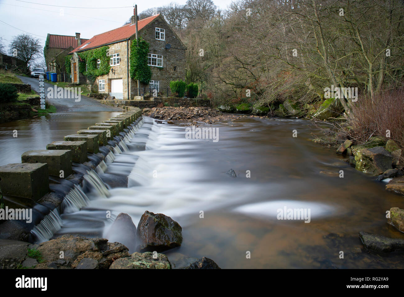 The ford and stepping stones crossing Eller Beck at Darnholm, Goathland, North York Moors National Park Stock Photo