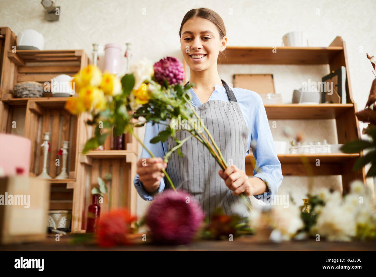 Florist Arranging Flowers Stock Photo