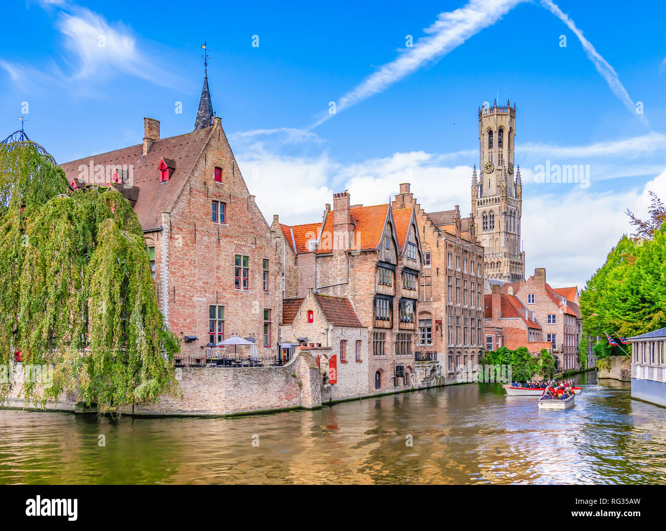 Popular viewpoint  in city center with traditional brick buildings along the canal in Bruges, Belgium Stock Photo