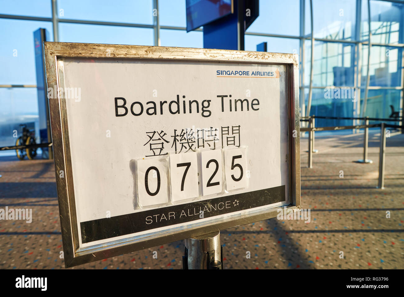 HONG KONG - CIRCA SEPTEMBER, 2016: boarding time sign at Hong Kong International Airport. Stock Photo