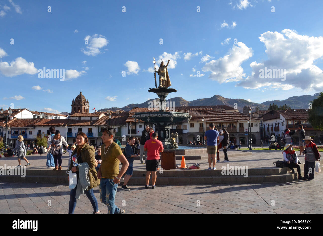 CUSCO / PERU, August 16, 2018: A couple walks past the Plaza de Armas in Cusco Stock Photo