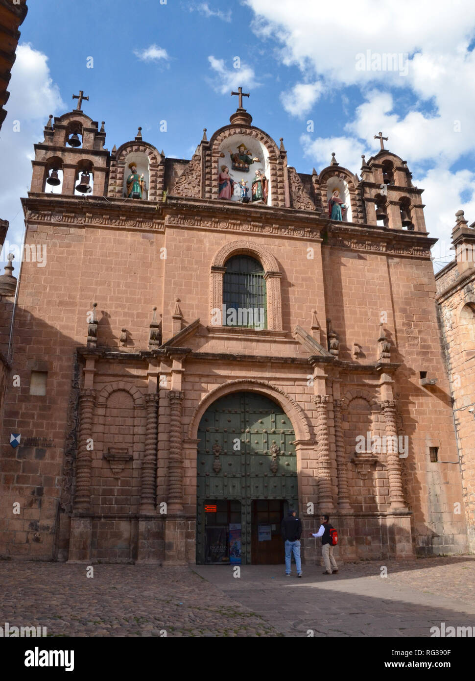 CUSCO / PERU, August 16, 2018: Tourists enter the Temple of the Sacred Family in Cusco. Stock Photo