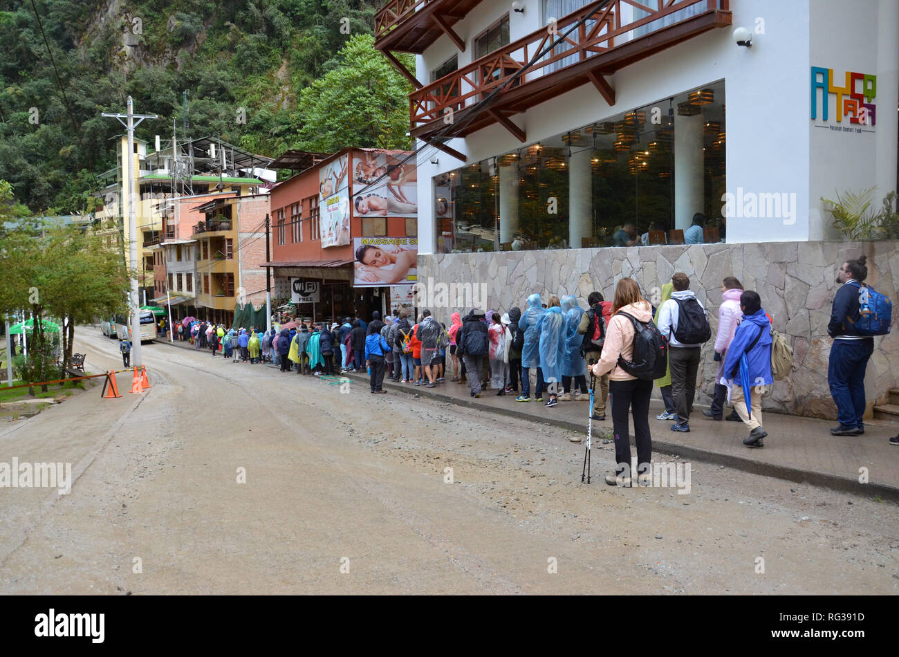 MACHU PICCHU / PERU, August 16, 2018: Tourists line up to get on the buses to go to Machu Picchu Stock Photo