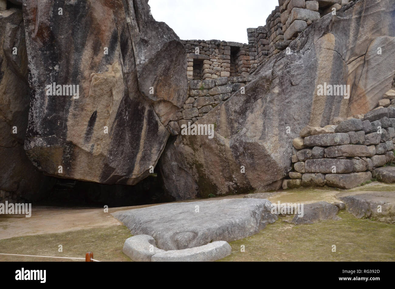 MACHU PICCHU / PERU, August 16, 2018: The rocks in the condor temple at Machu Picchu are shaped like condor wings and its head. Stock Photo