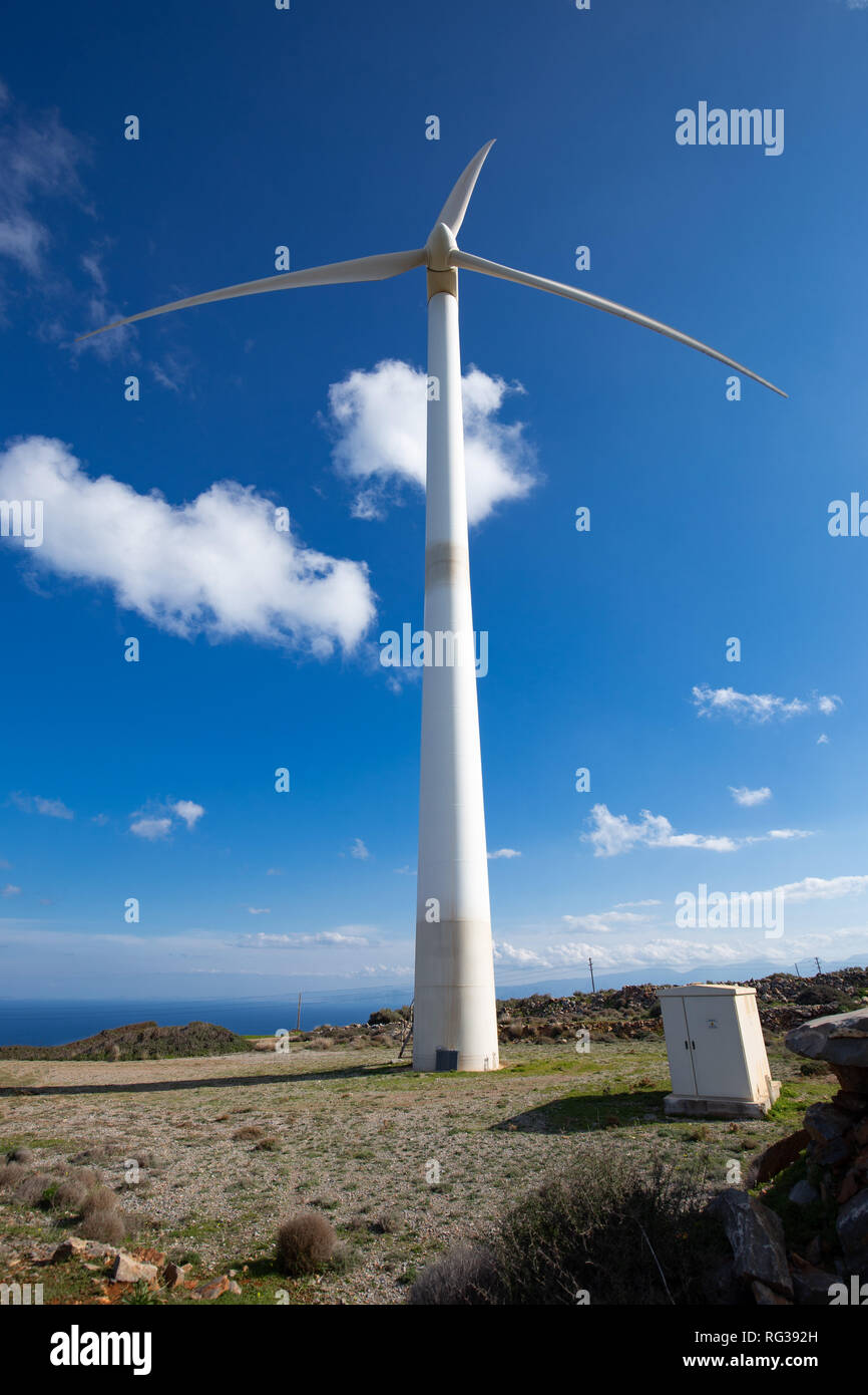 wind turbine over Elounda VIllage Crete Greece Stock Photo
