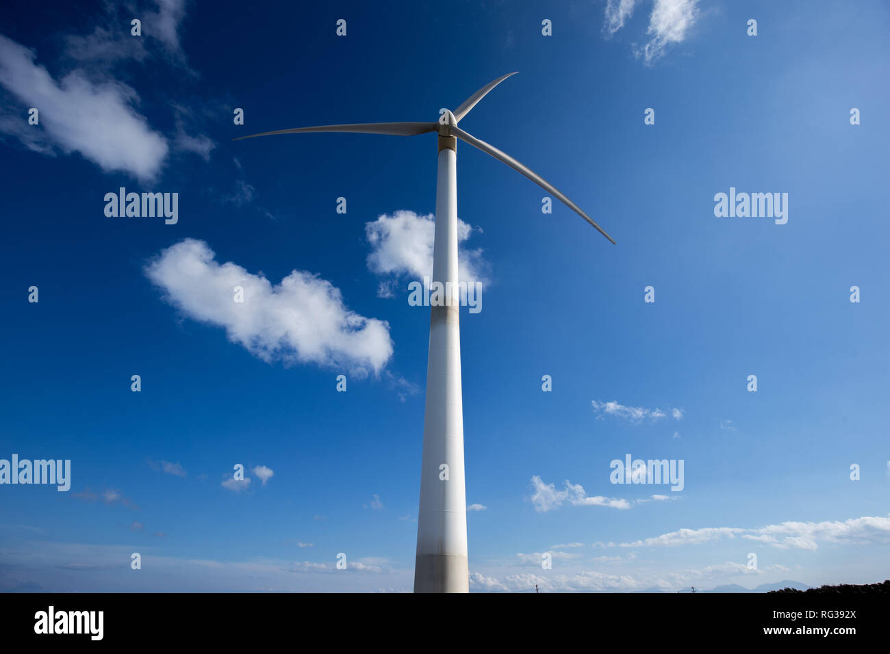 wind turbine over Elounda VIllage Crete Greece Stock Photo