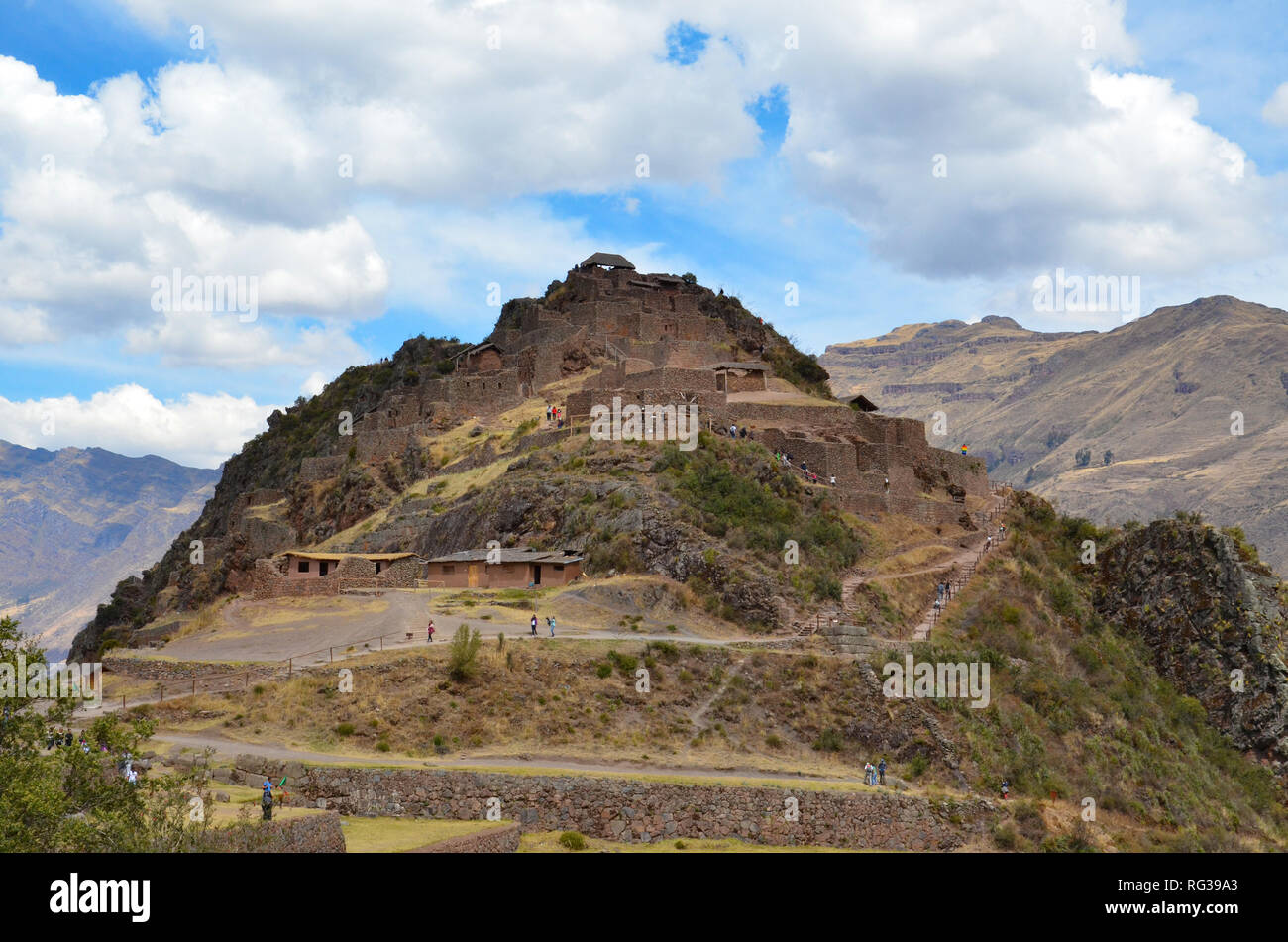 PISAQ / PERU, August 16, 2018: Tourists explore the ruins of Pisaq near Cusco. Stock Photo