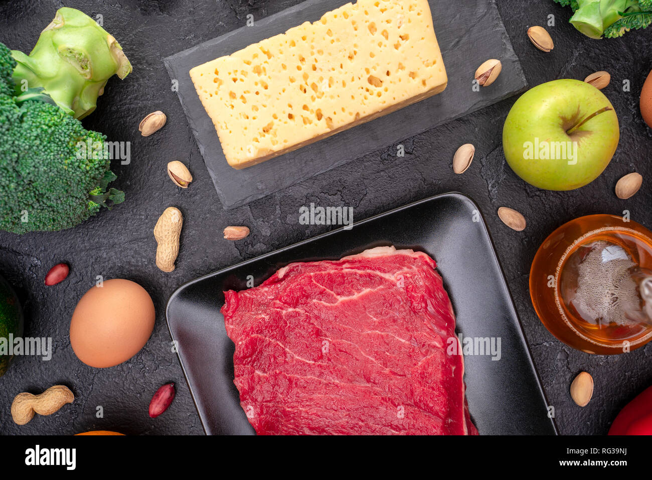 Picture of products for diet on empty black background. Stock Photo