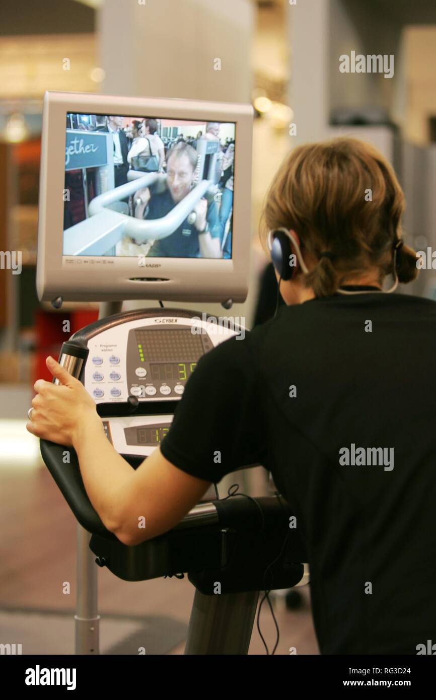DEU, Germany, Essen : FIBO, Fitness and leisure exhibition. cycle exercise machine with tv/video screen Stock Photo