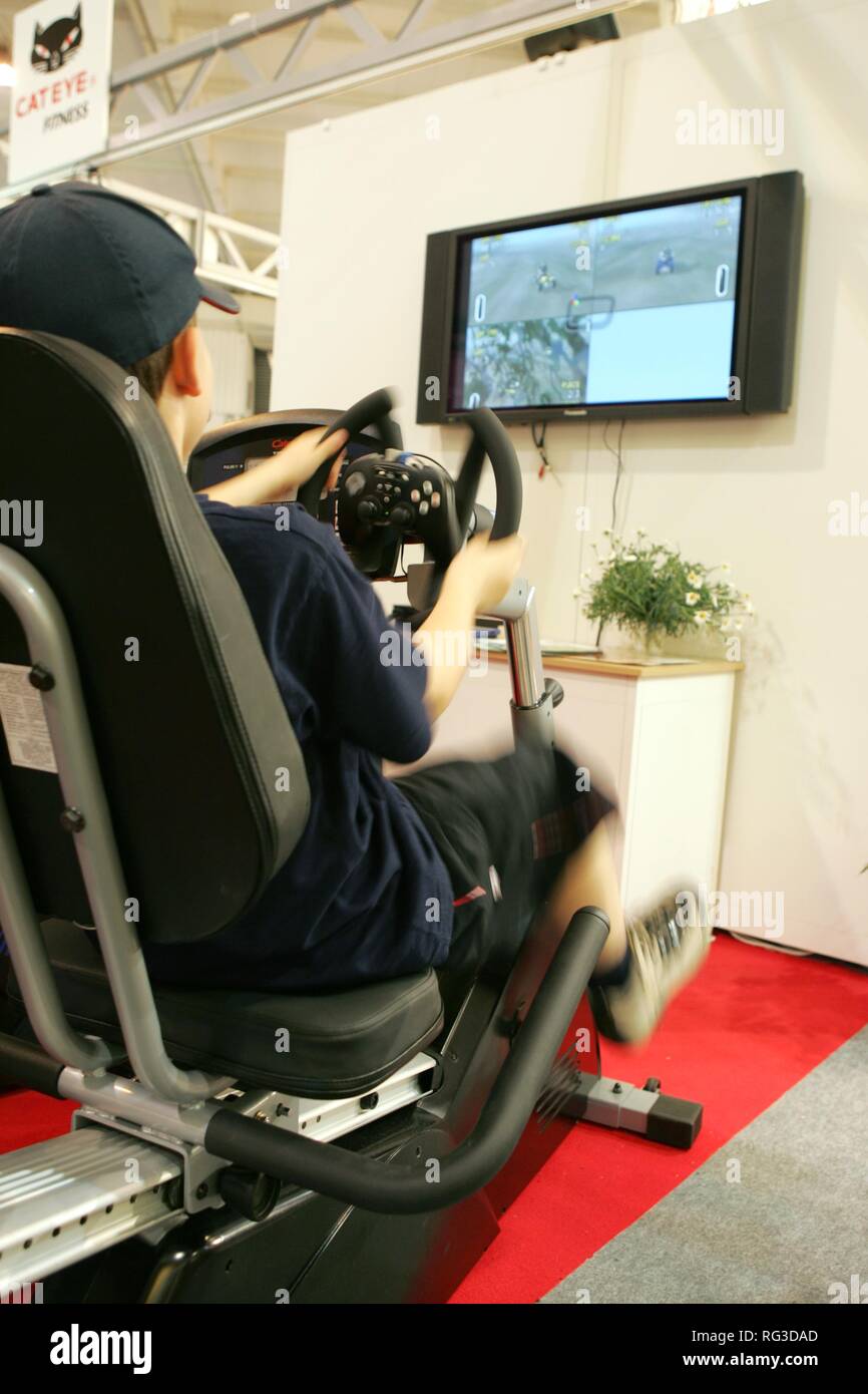 DEU, Germany, Essen : FIBO, Fitness and leisure exhibition. cycle exercise machine with tv/video screen. Vido game works only if Stock Photo