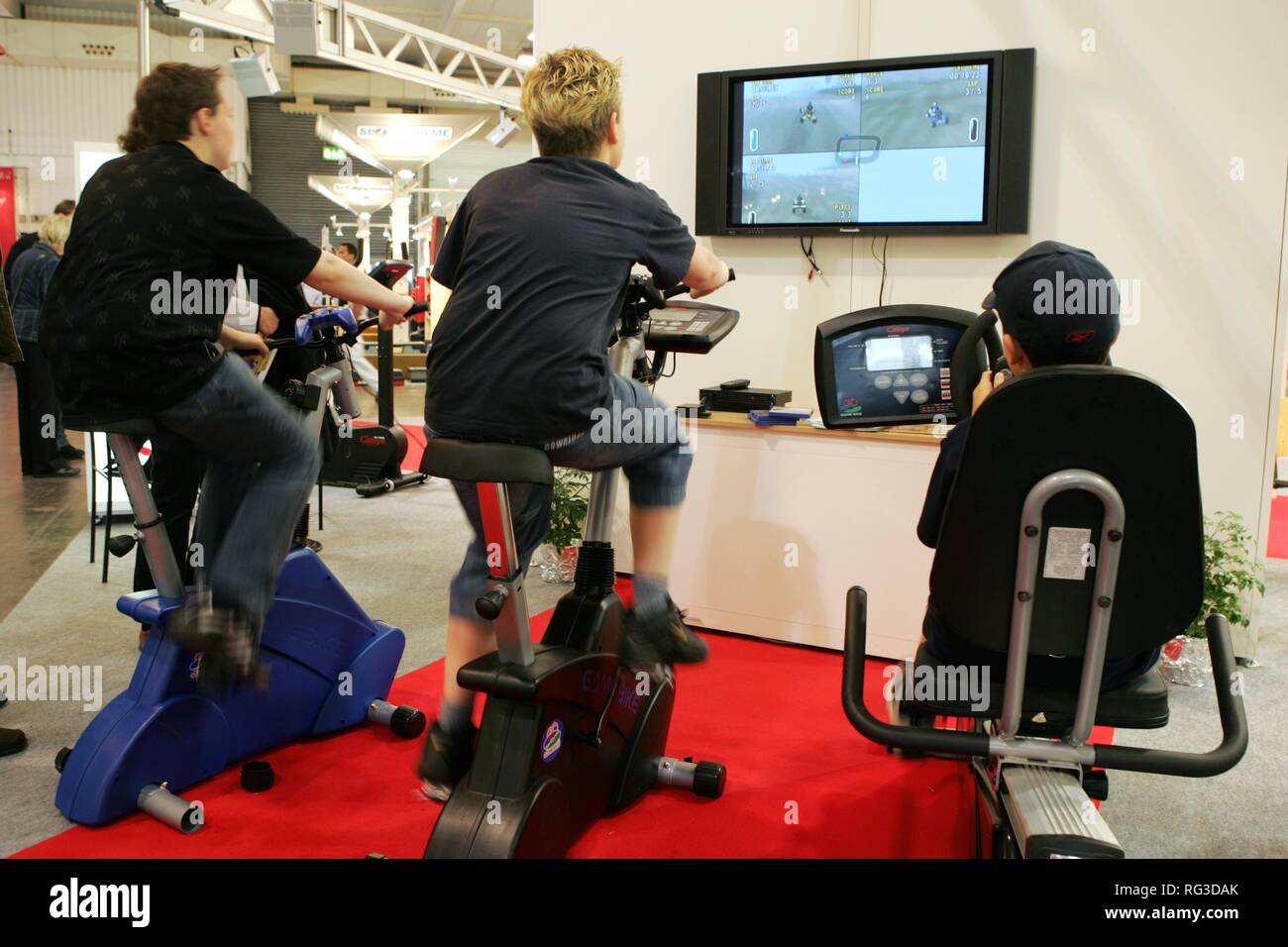 DEU, Germany, Essen : FIBO, Fitness and leisure exhibition. cycle exercise machine with tv/video screen. Vido game works only if Stock Photo
