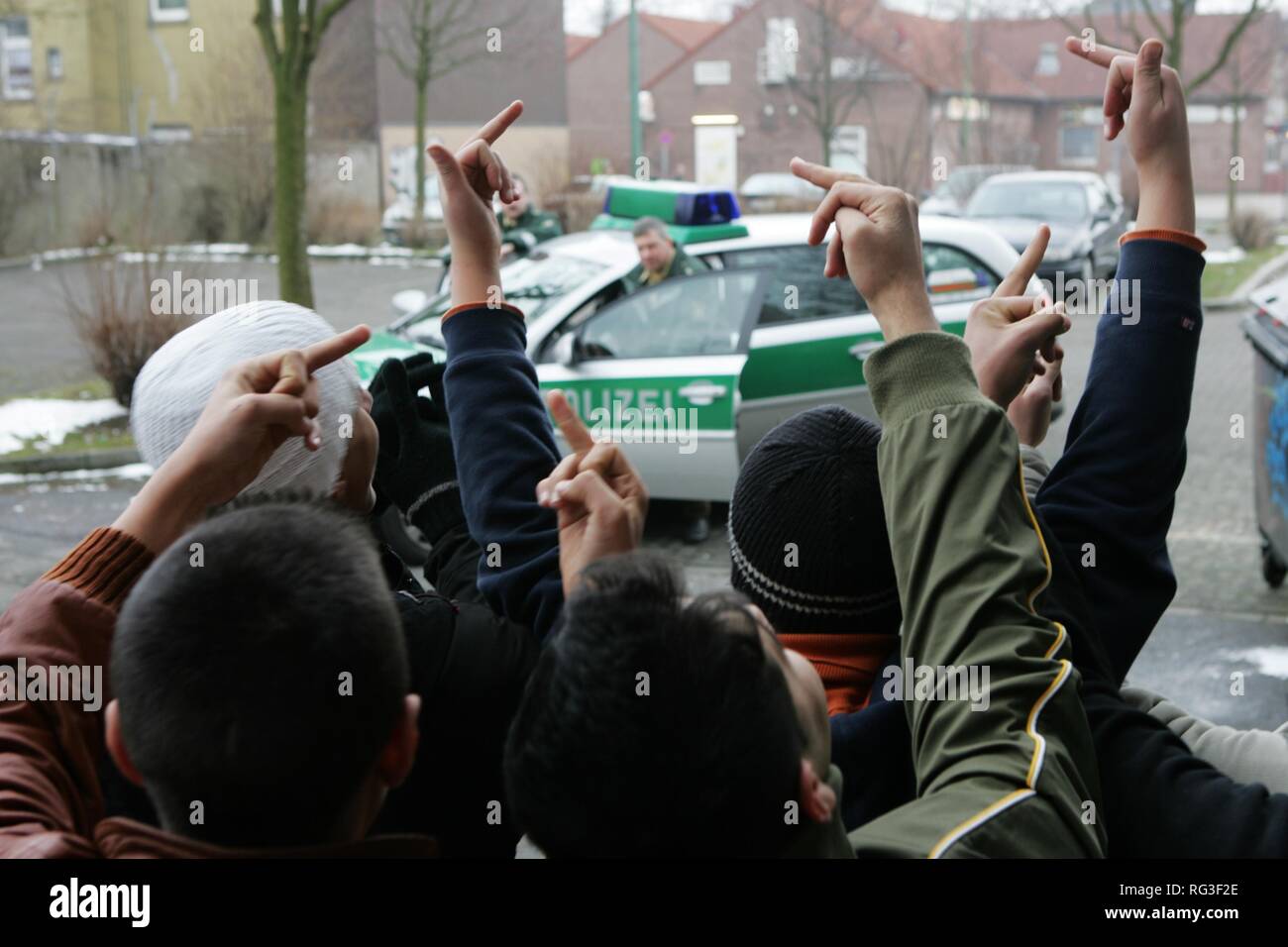 DEU, Germany : juvenile crime. Young man is arrested by the police. Young boys protesting against the police.(posed scene) Stock Photo