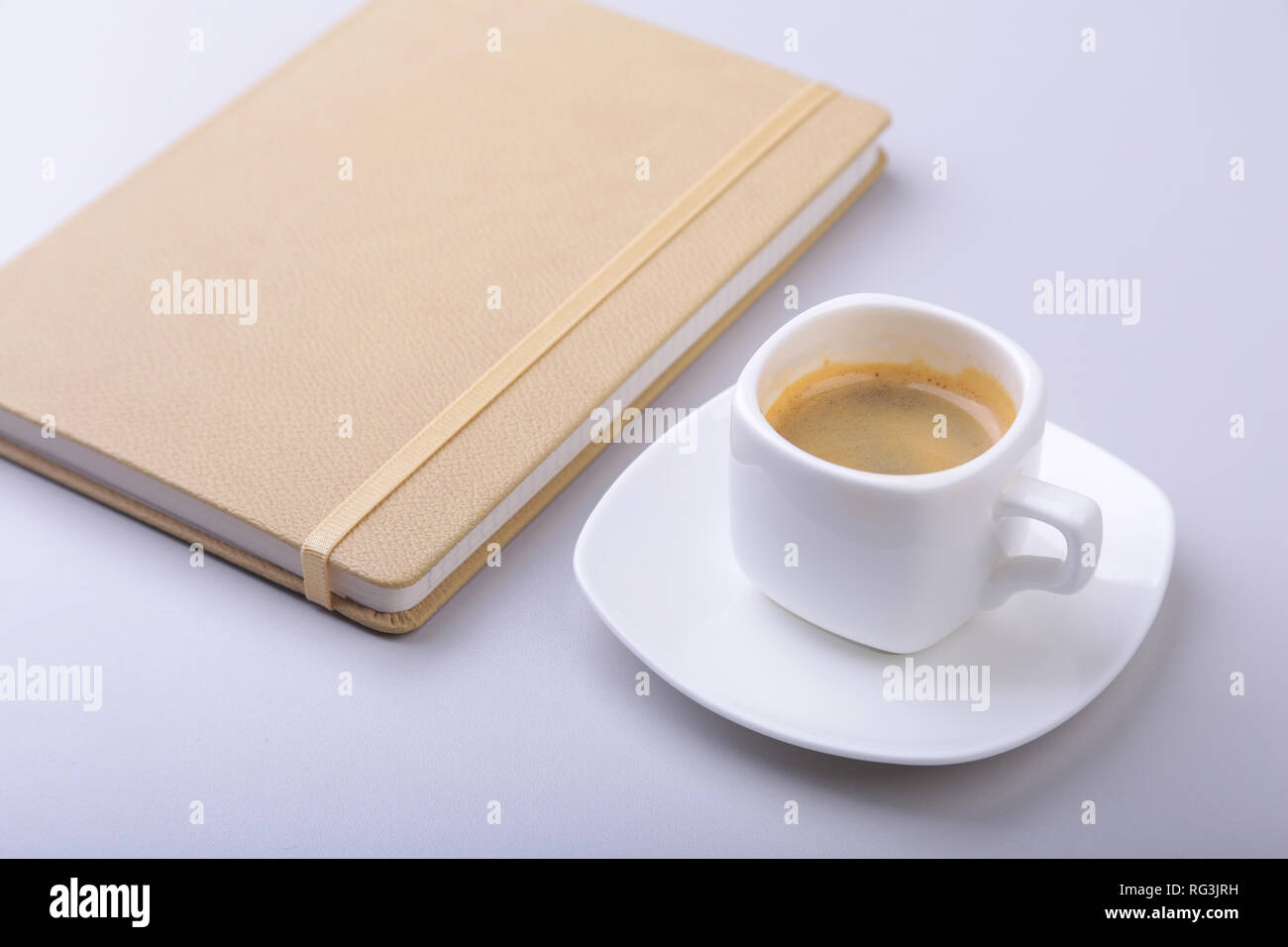 office table with notebook, computer keyboard,, cup of coffee, tablet pc. copy space. Stock Photo