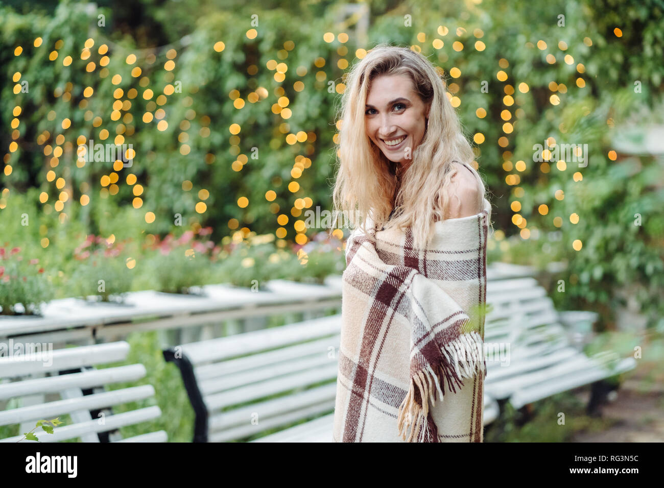 Beautiful girl posing in the park at the camera Stock Photo - Alamy