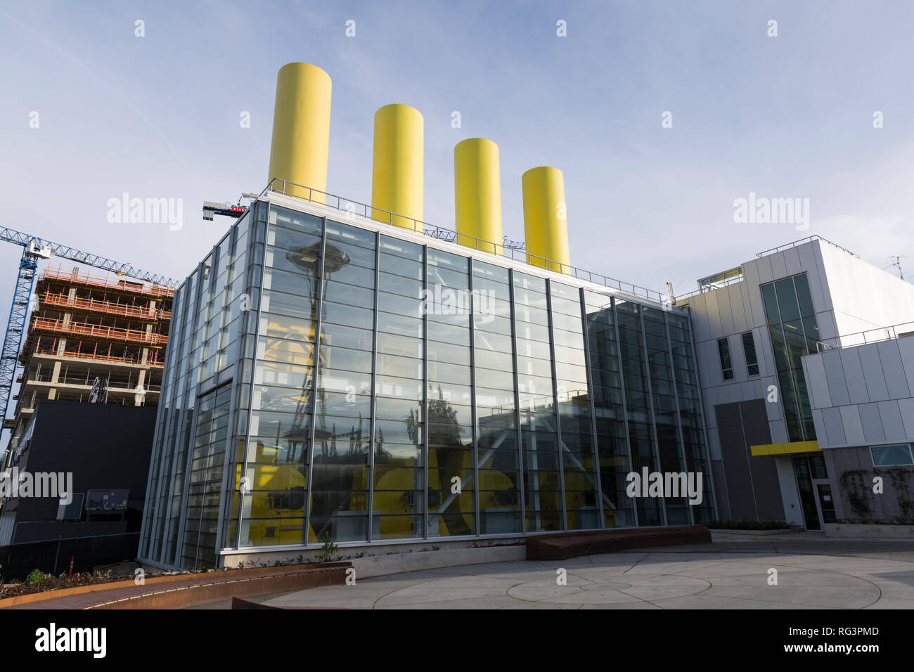 Seattle, Washington: The Space Needle is reflected in the modern glass façade of the new SR 99 tunnel’s north operations building. The highway closed  Stock Photo