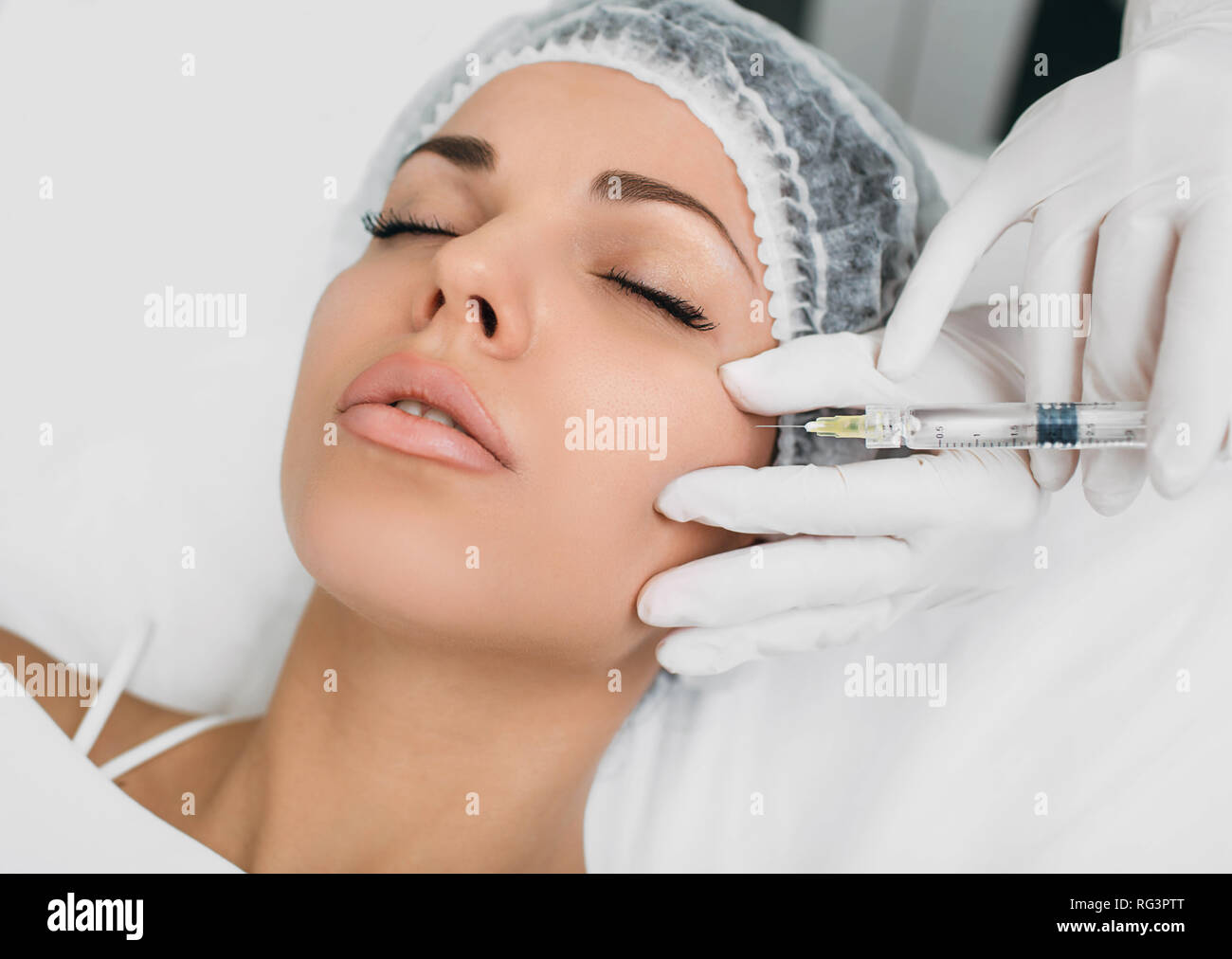 botulinum toxin injection into face, for lifting skin . Face injection top view Stock Photo