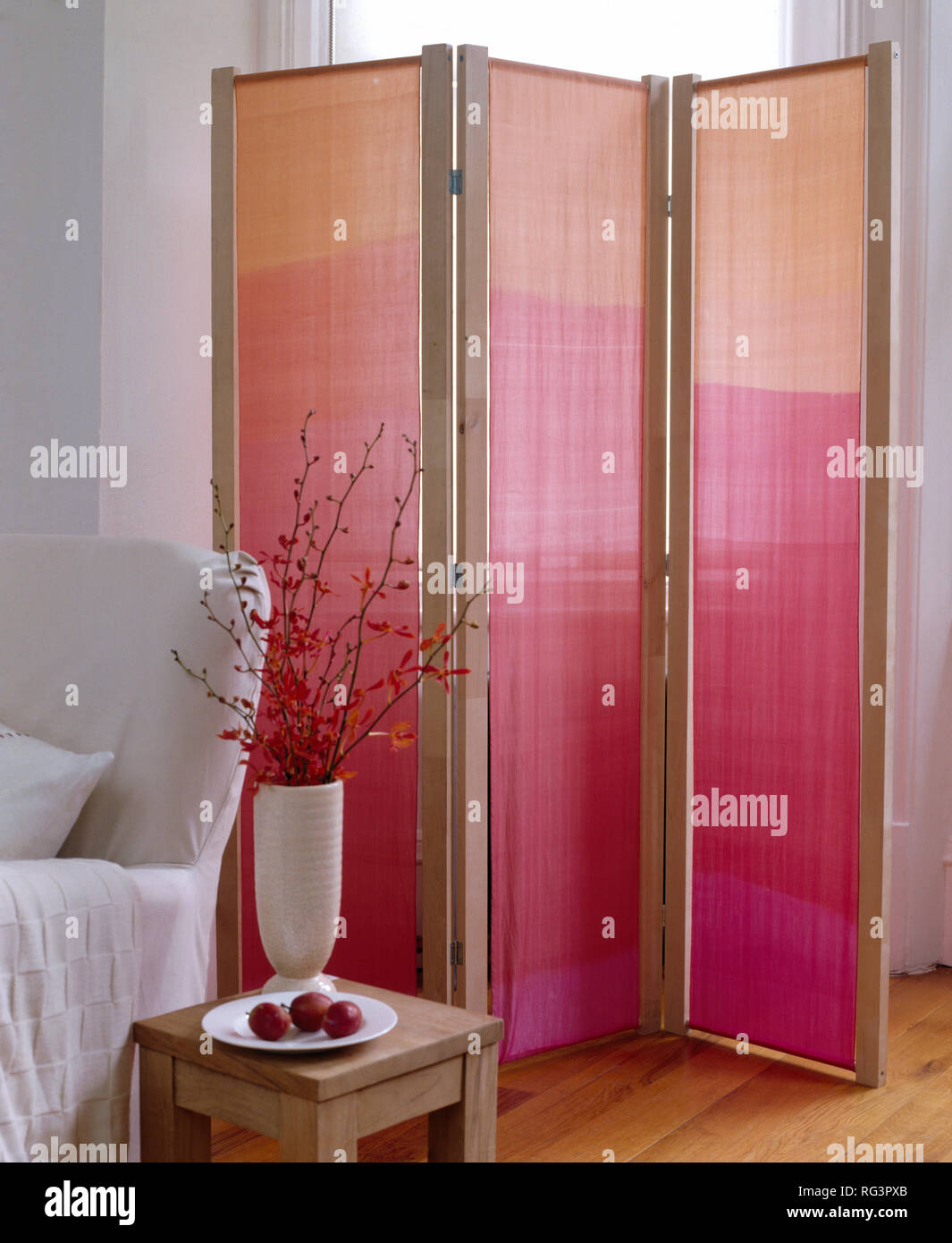 Folding wooden screen with pink fabric panels Stock Photo Alamy
