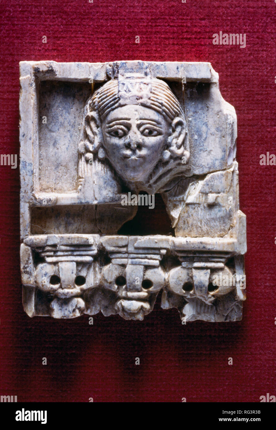 Woman at the window: Nimrud Ivory from Room SW37 Fort Shalmaneser within the Assyrian city of Nimrud, northern Iraq, photographed in Birmingham Museum Stock Photo
