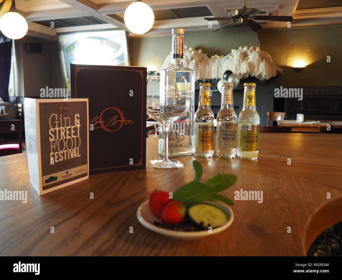 Gin & street festival table talker for a pub in Watford with Martin Miller's gin and fevertree tonics - Watford - Hertfordshire - UK Stock Photo