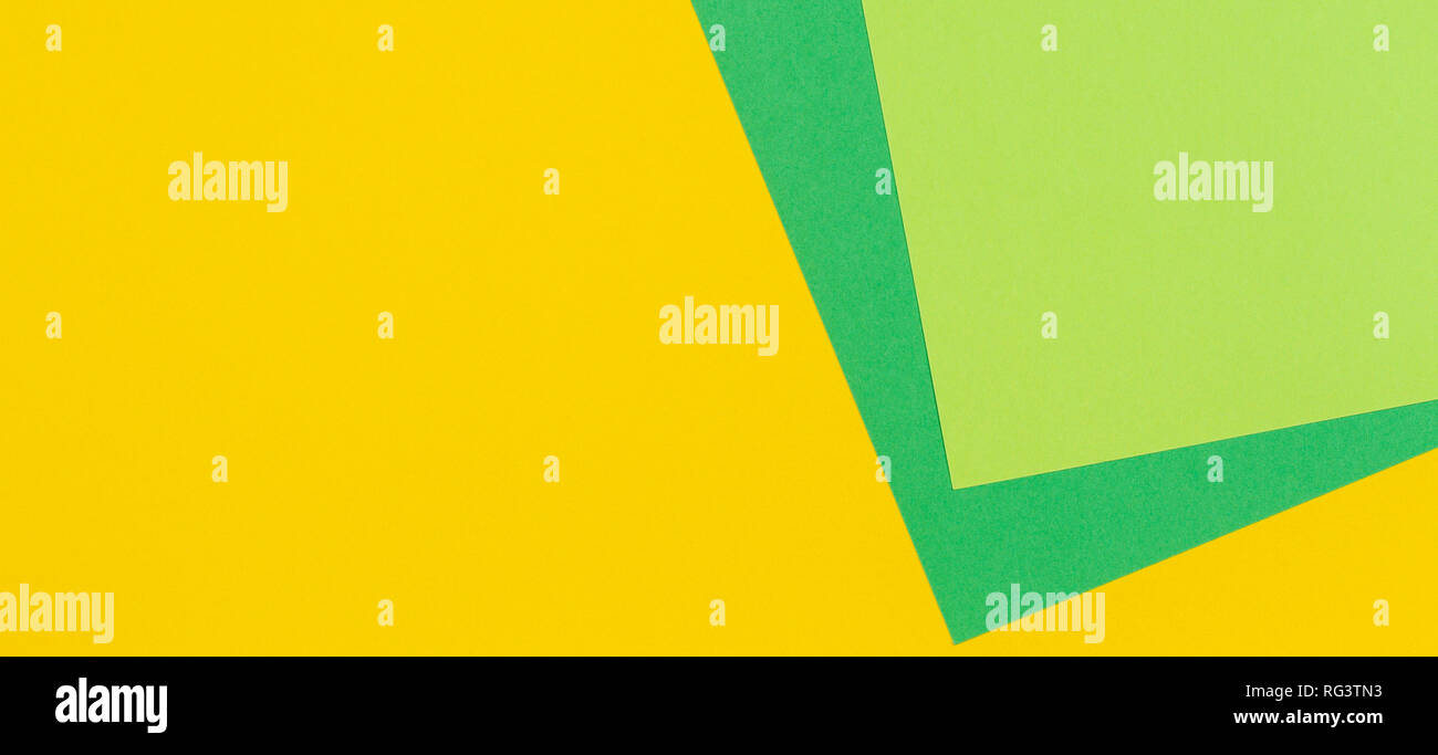 Geometric flat lay yellow and green color paper background Stock Photo ...