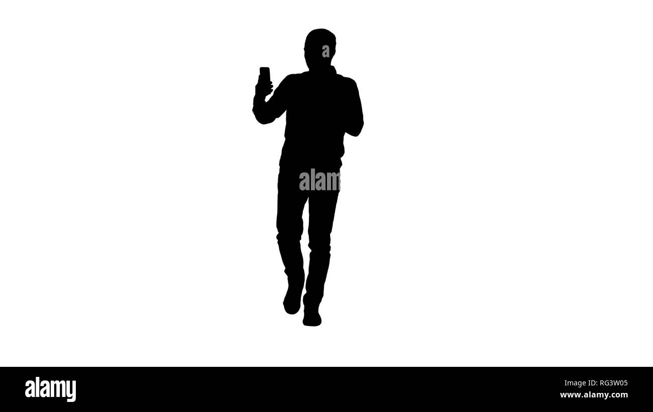 Full length portrait. Silhouette Man calling via video call on phone talking to someone waving hello during videochat conversation. Professional shot  Stock Photo