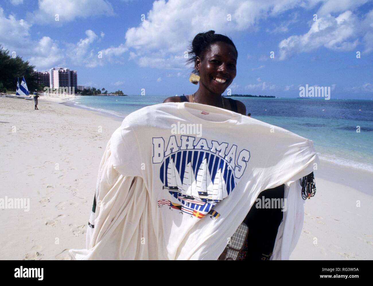 BHS, Bahamas:T-shirt seller at Goodman's Bay beach. Independent state in  the West Indies, member of Comonwealth of Nations Stock Photo - Alamy