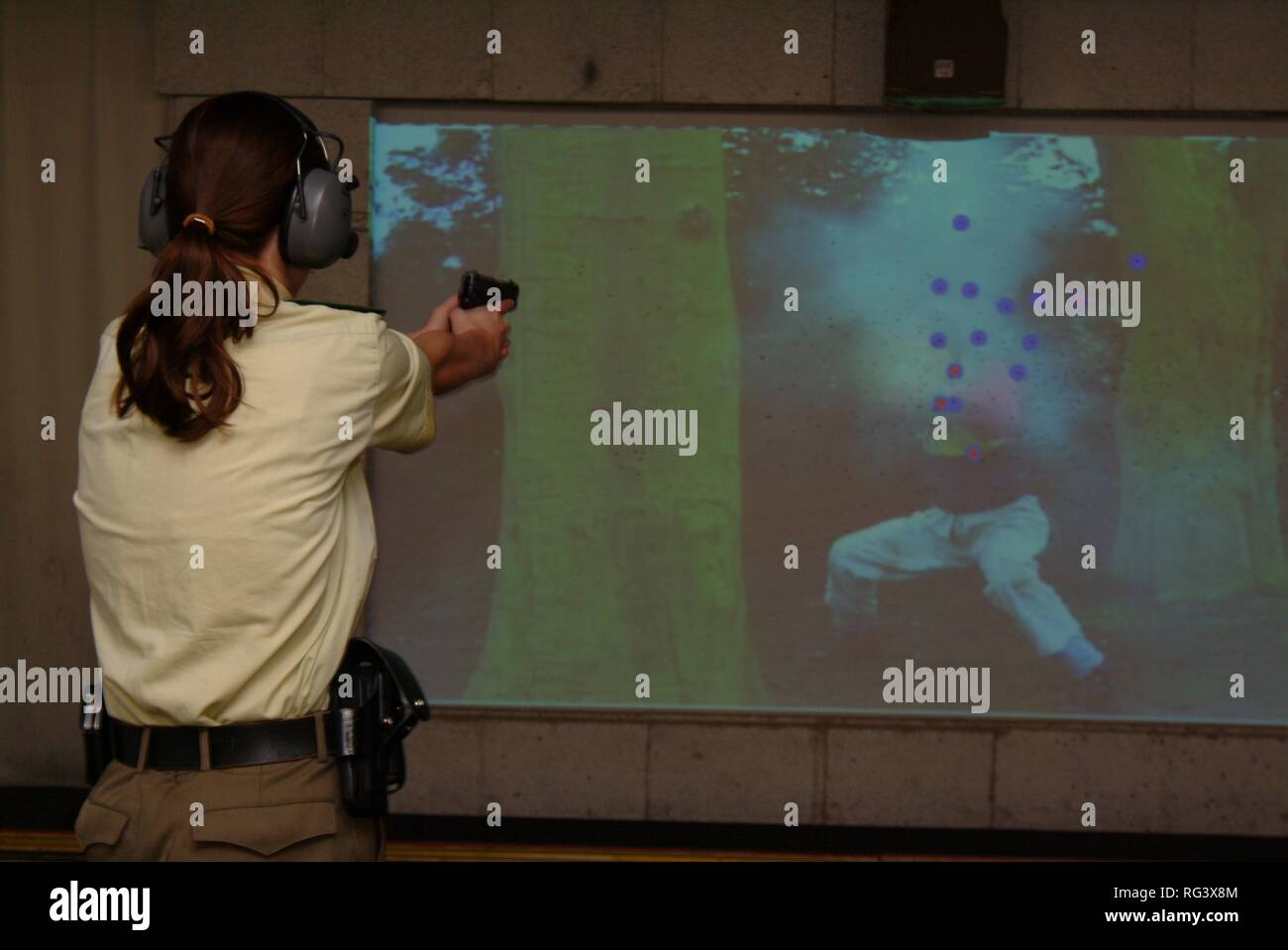 DEU, Germany, Essen : German police officer in a training shooting range. Different movies and situations are shown and the Stock Photo