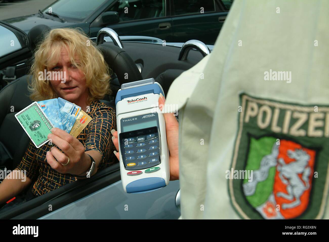 DEU, Germany, Duisburg: creditcard payment for speeding or other police tickets. Driver or other people who have to pay a ticket Stock Photo