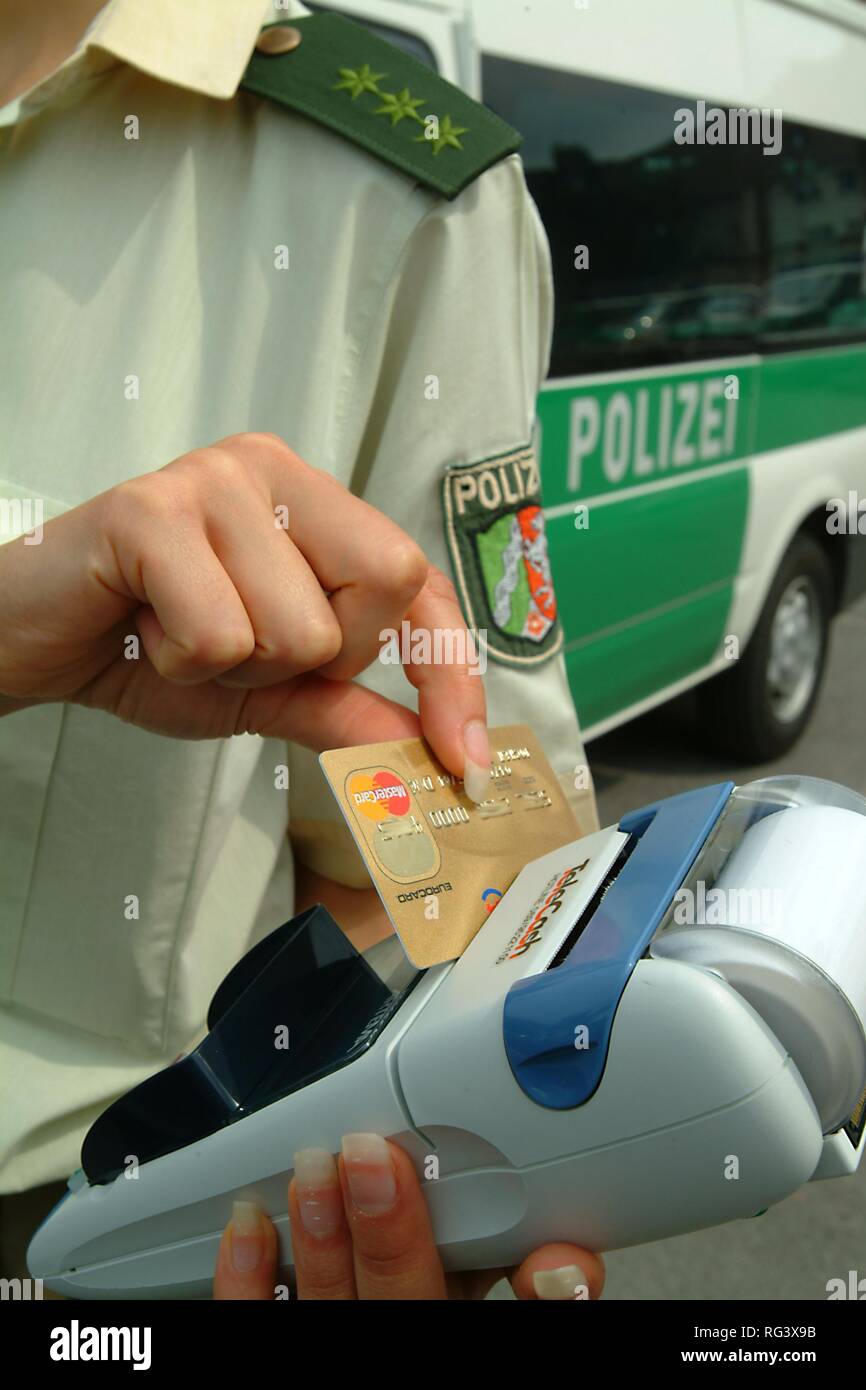 DEU, Germany, Duisburg: creditcard payment for speeding or other police tickets. Driver or other people who have to pay a ticket Stock Photo