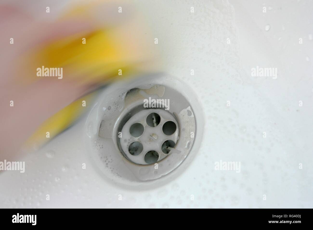DEU, Germany : Housecleaning in a private house/apartment. Cleaning in the bathroom. Stock Photo