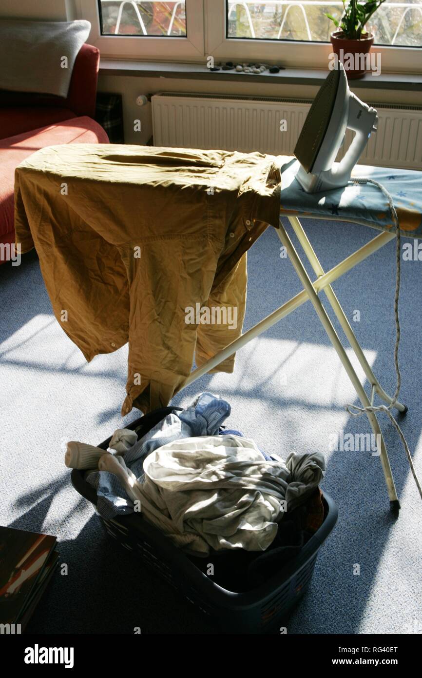 DEU, Germany : Iron of laundry at home. Steam iron. Stock Photo