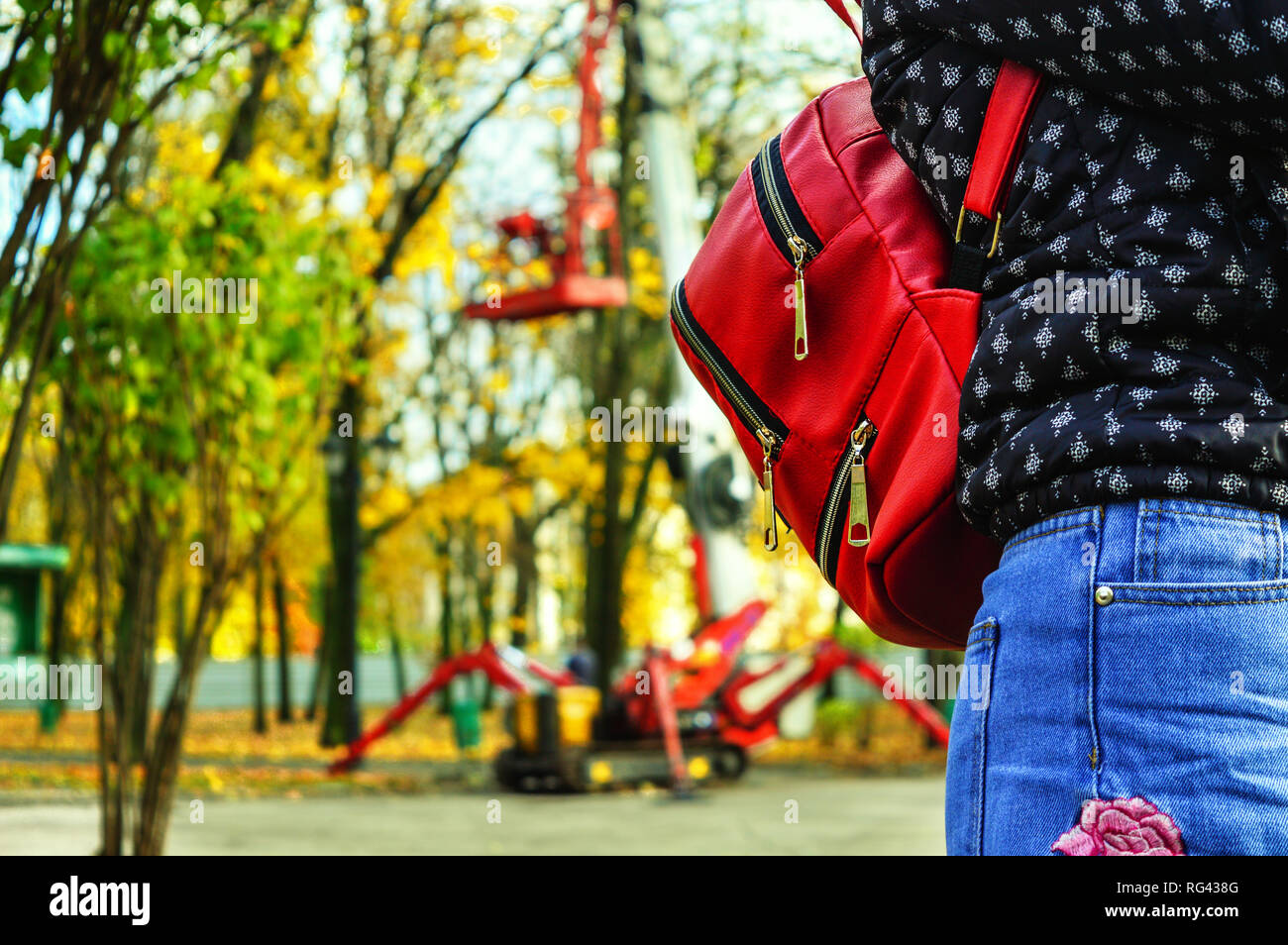Woman backpack yellow jacket hi-res stock photography and images - Alamy