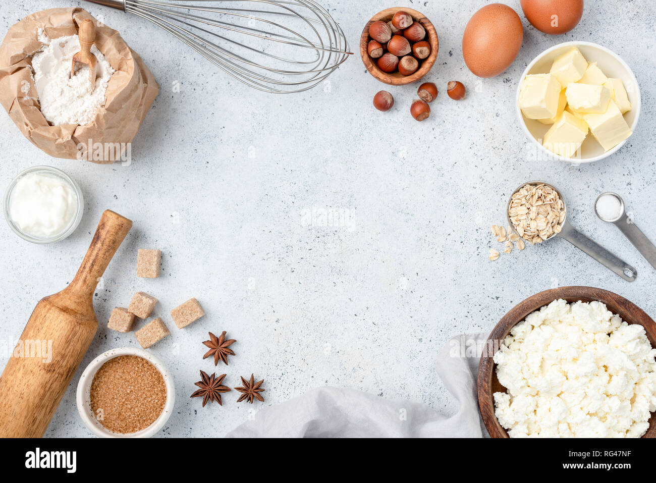 Baking concept, baking ingredients on background. Ingredients for baking cake, cookies, bread or pastry. Frame of cooking kitchen utensils and food Stock Photo