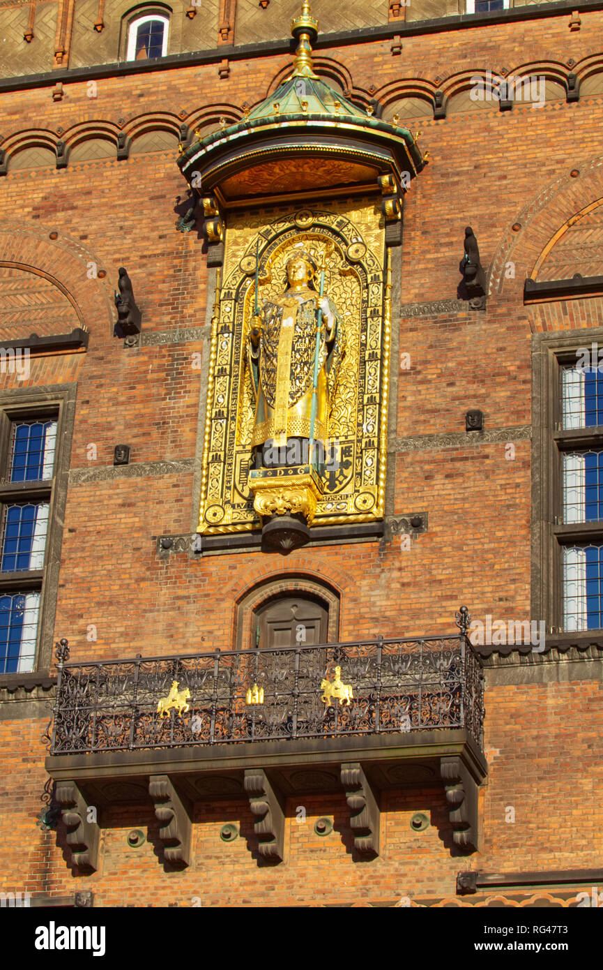 June 26, 2018- Copenhagen, Denmark: The gold bishop statue on the side of the city hall building in Copenhagen Stock Photo